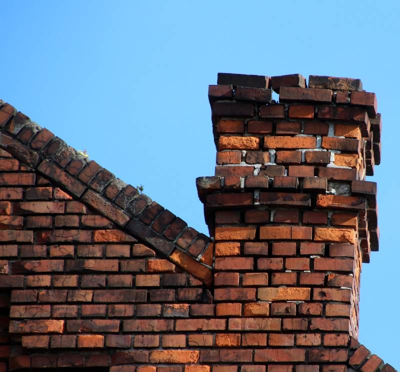 Signs Your Redondo Beach Home Needs a Chimney Inspection Damaged chimney on an Redondo Beach home showing cracks and missing mortar